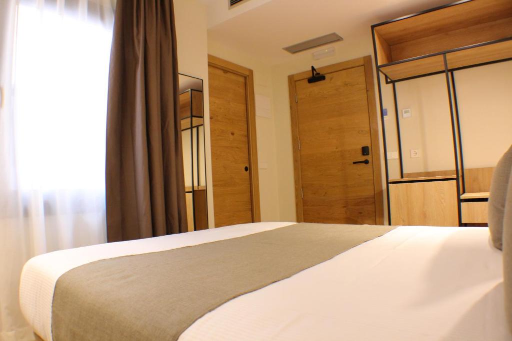 Postel nebo postele na pokoji v ubytování Hotel Marfany