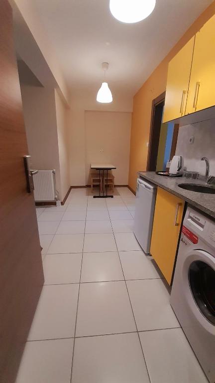 Kuchyň nebo kuchyňský kout v ubytování Moda Hotel