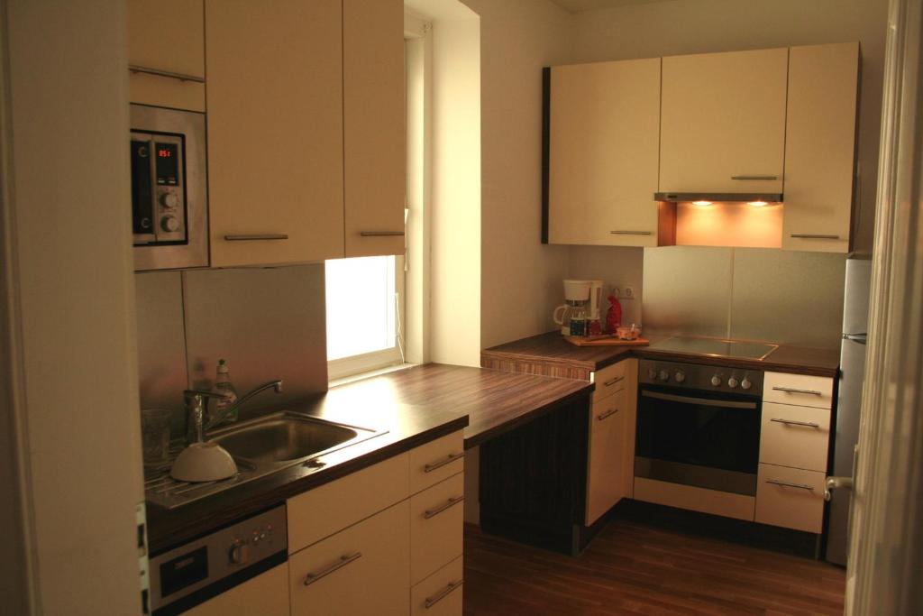 Kjøkken eller kjøkkenkrok på Appartement Neusiedl am See mit Dachterrasse