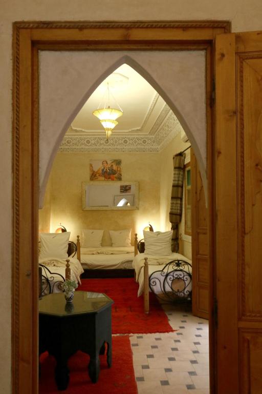 Postel nebo postele na pokoji v ubytování Riad Maissoun