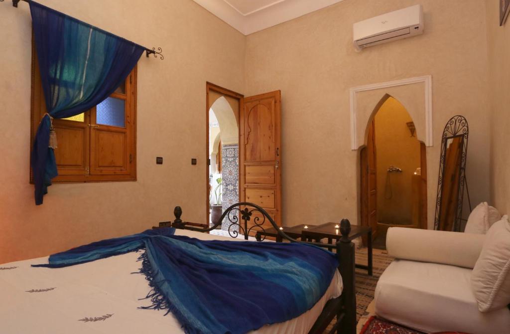 Postel nebo postele na pokoji v ubytování Riad Maissoun