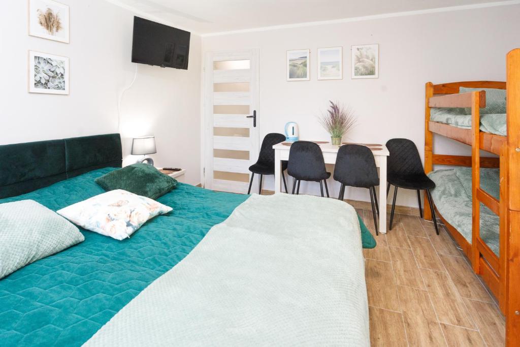 Postel nebo postele na pokoji v ubytování Zacisze Sosnowe
