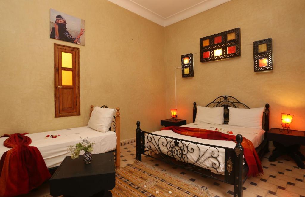Postel nebo postele na pokoji v ubytování Riad Maissoun