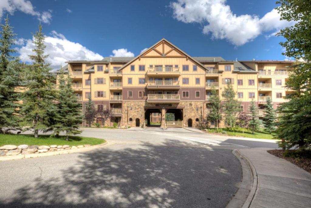 a large apartment building with a road in front of it at Red Hawk Lodge by Summit County Mountain Retreats in Keystone