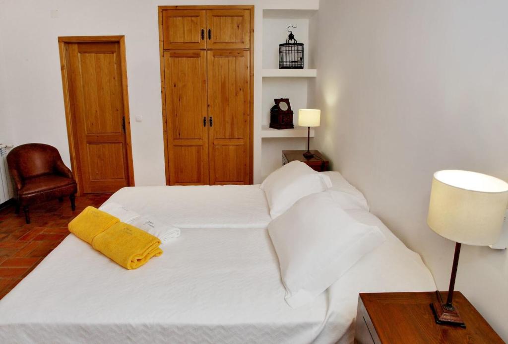 Postel nebo postele na pokoji v ubytování Quinta do Chocalhinho Agroturismo & SPA