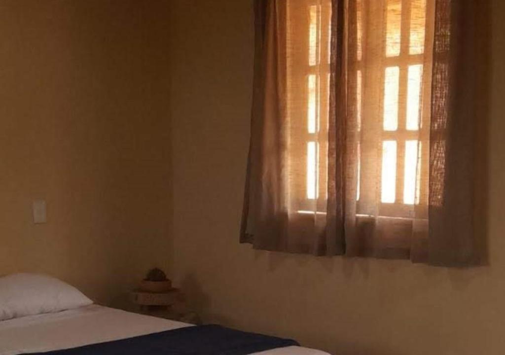 Postel nebo postele na pokoji v ubytování Vila Sincorá - Chalé para 4 pessoas com cozinha a 2 km da portaria da Cachoeira do Buracão