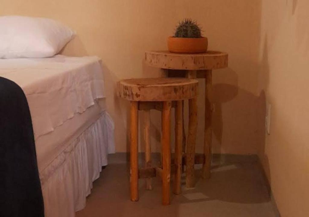 Postel nebo postele na pokoji v ubytování Vila Sincorá - Chalé para 4 pessoas com cozinha a 2 km da portaria da Cachoeira do Buracão