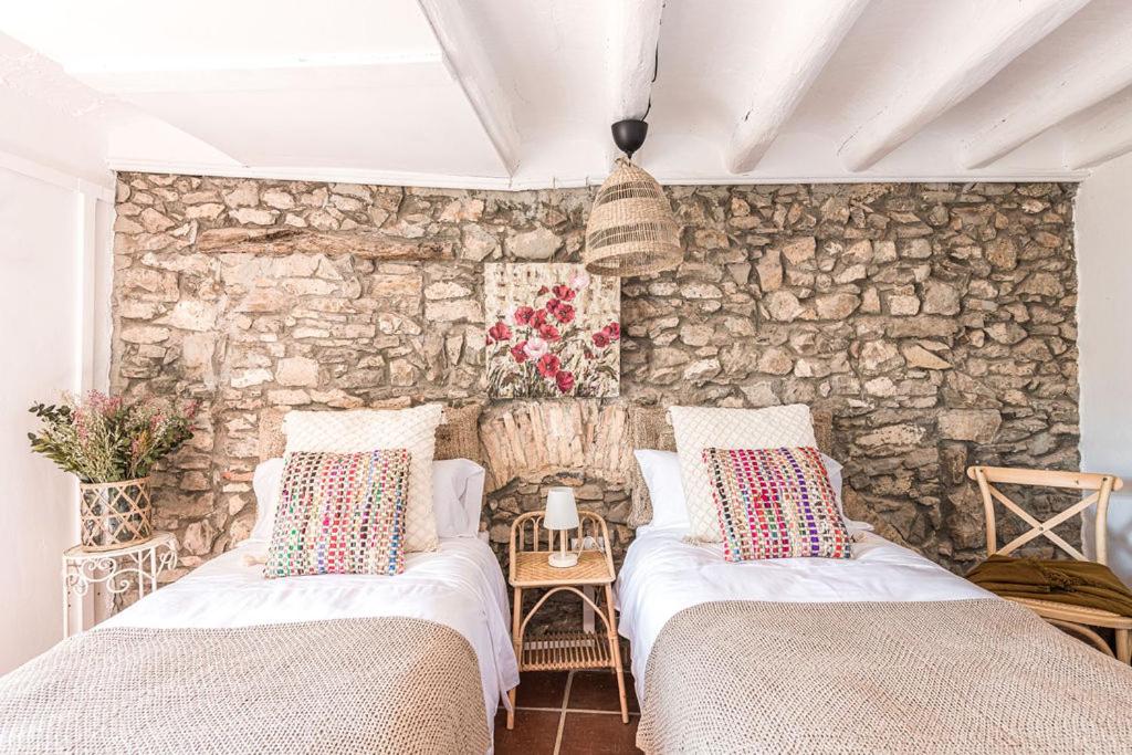 A bed or beds in a room at Casa Pardal Coliving & Coworking