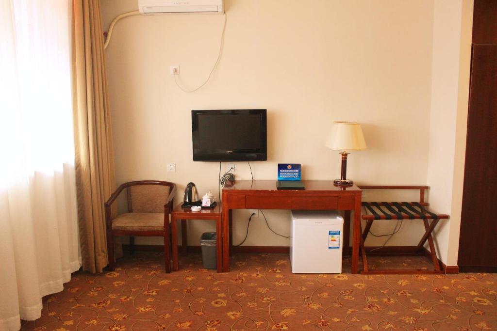TV a/nebo společenská místnost v ubytování King Parkview Hotel