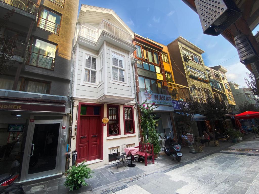 a building with a red door on a city street at Çırağan's Omnia Hotel in Istanbul