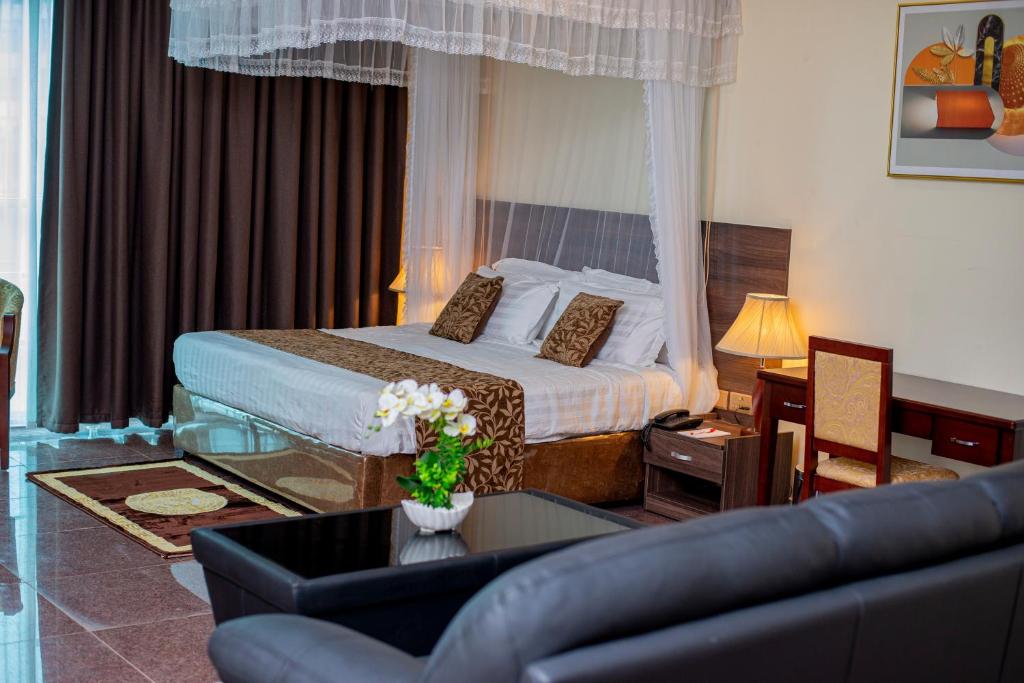 Postel nebo postele na pokoji v ubytování Koki Hotel