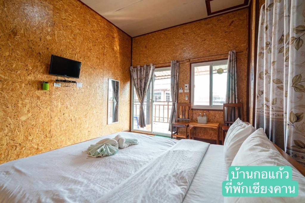 Postel nebo postele na pokoji v ubytování Baan Kokaew Chiang Khan