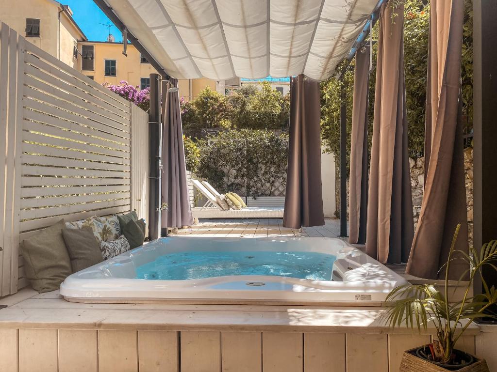 a jacuzzi tub sitting on a patio at Hotel Sant'Andrea in Santa Margherita Ligure