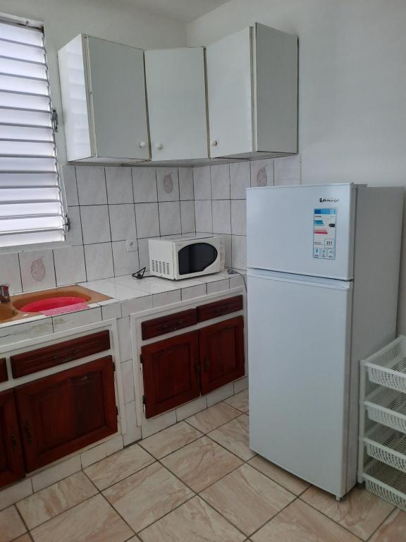 Kuchyň nebo kuchyňský kout v ubytování F3 paisible