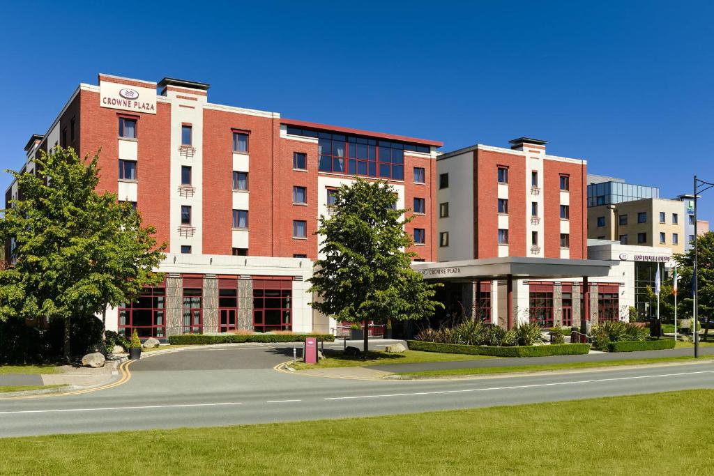 a large building with a road in front of it at Crowne Plaza Dublin Airport by IHG in Santry