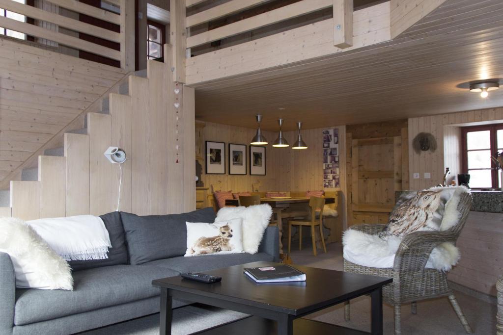 a living room with a couch and a table at Hannig in Saas-Fee