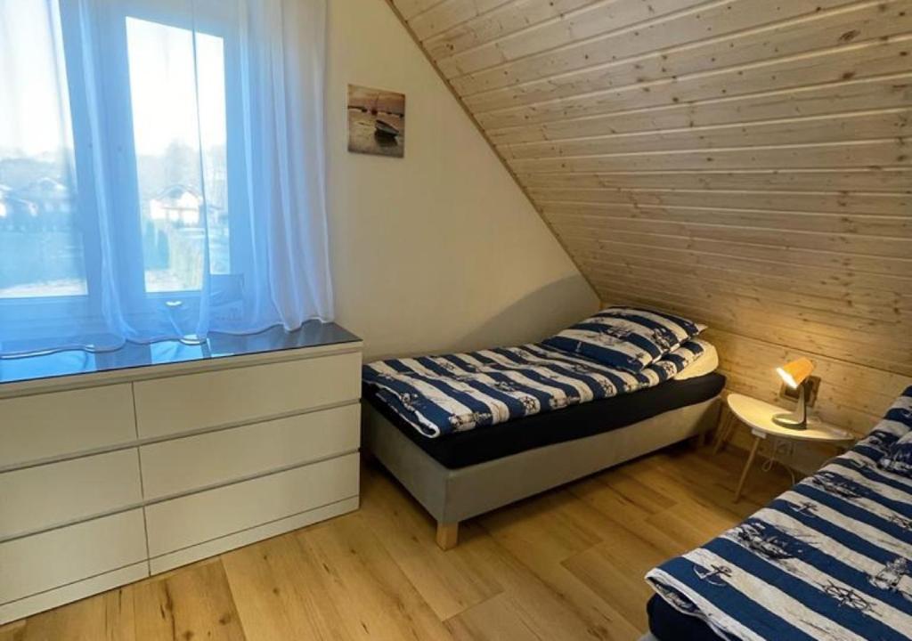 Posteľ alebo postele v izbe v ubytovaní Domek Maciej