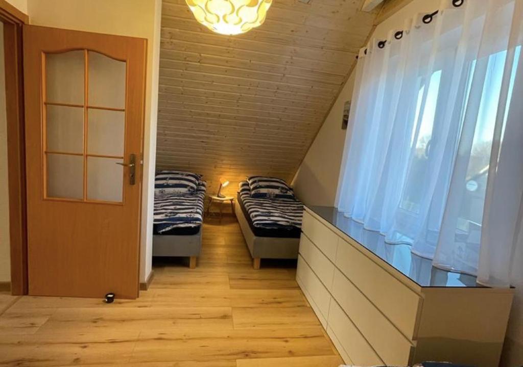 Posteľ alebo postele v izbe v ubytovaní Domek Maciej