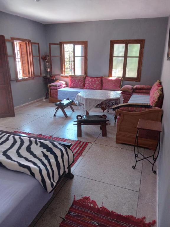a living room with a couch and a table at PalmTree A/2 in El Jadida