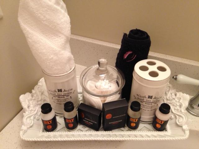 a bathroom counter with some products on a shelf at Casa Blanca Boutique Bed & Breakfast in Niagara-on-the-Lake