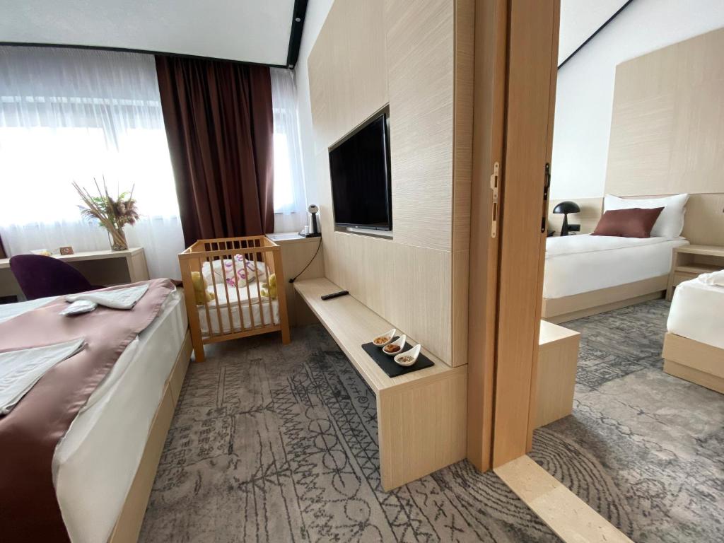 Uma cama ou camas num quarto em Hotel Boss