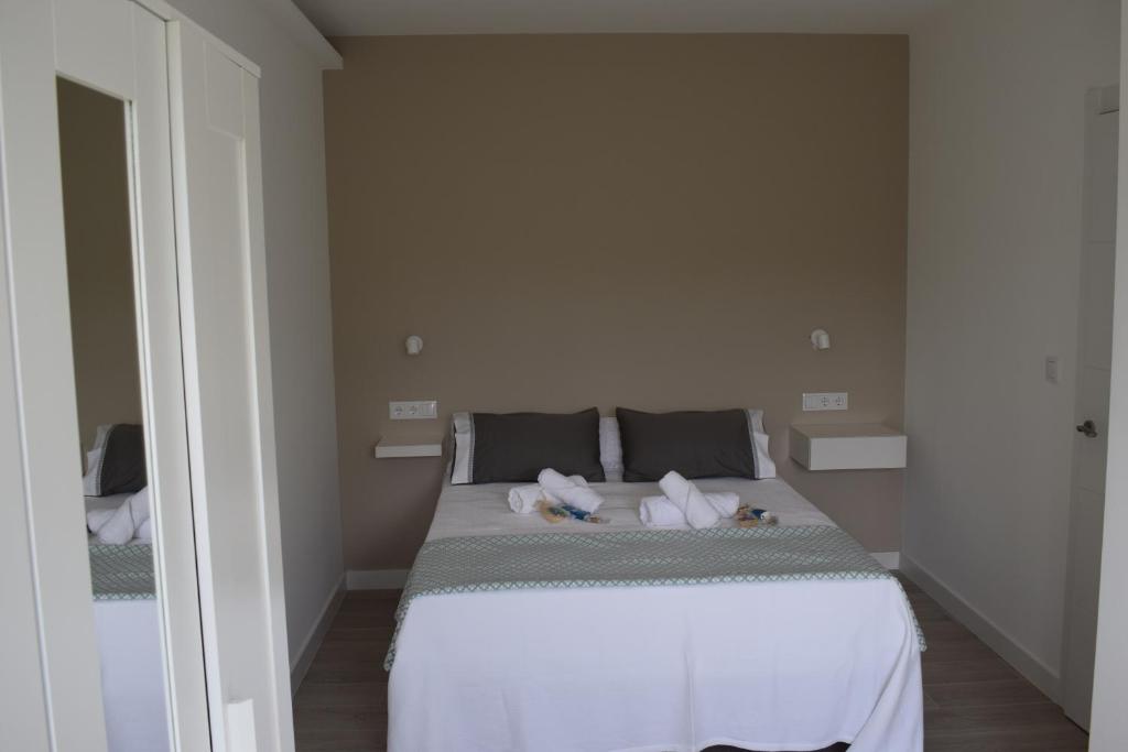 Postel nebo postele na pokoji v ubytování Apartamento Corcubica mirando al mar