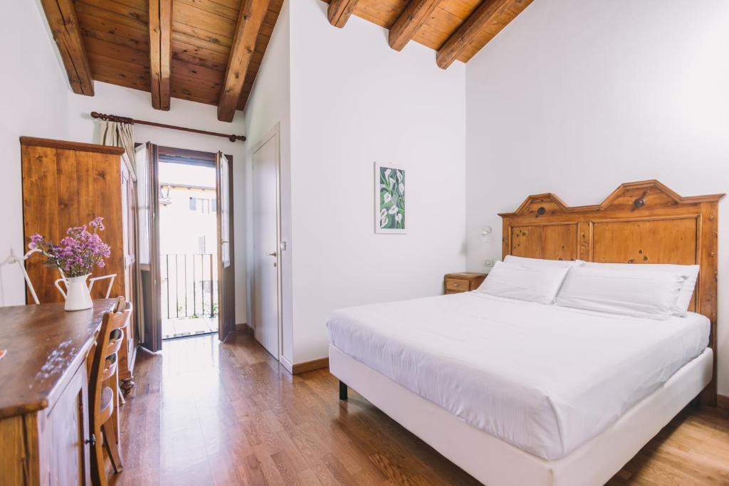 Postel nebo postele na pokoji v ubytování Agriturismo Albafiorita