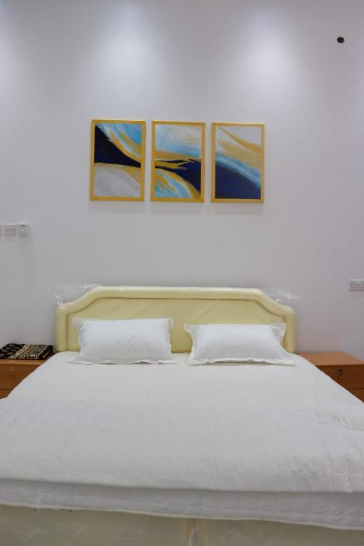 Katil atau katil-katil dalam bilik di استراحة مارينا ضباب marina dibab guste house