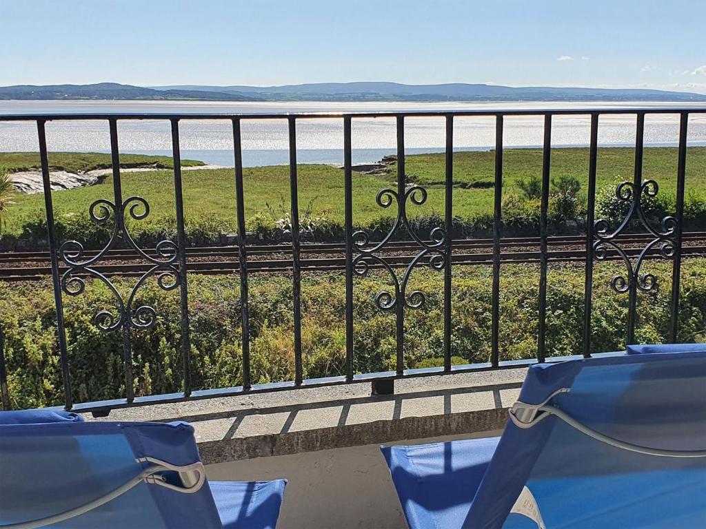 a view of the ocean from a balcony at Dolphin Cottage in Grange Over Sands