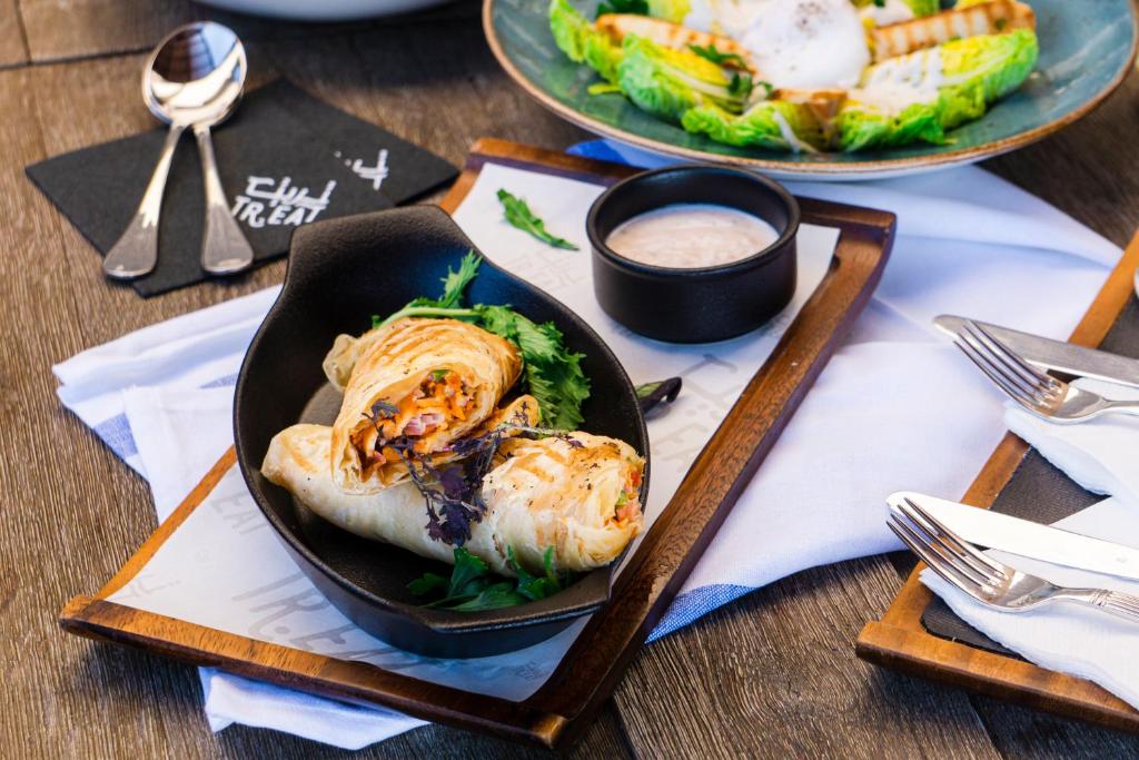 a plate of food on a table with a plate of food at InterContinental Muscat by IHG in Muscat