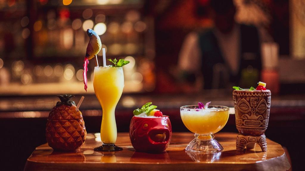 a group of drinks on a table in a bar at InterContinental Muscat by IHG in Muscat