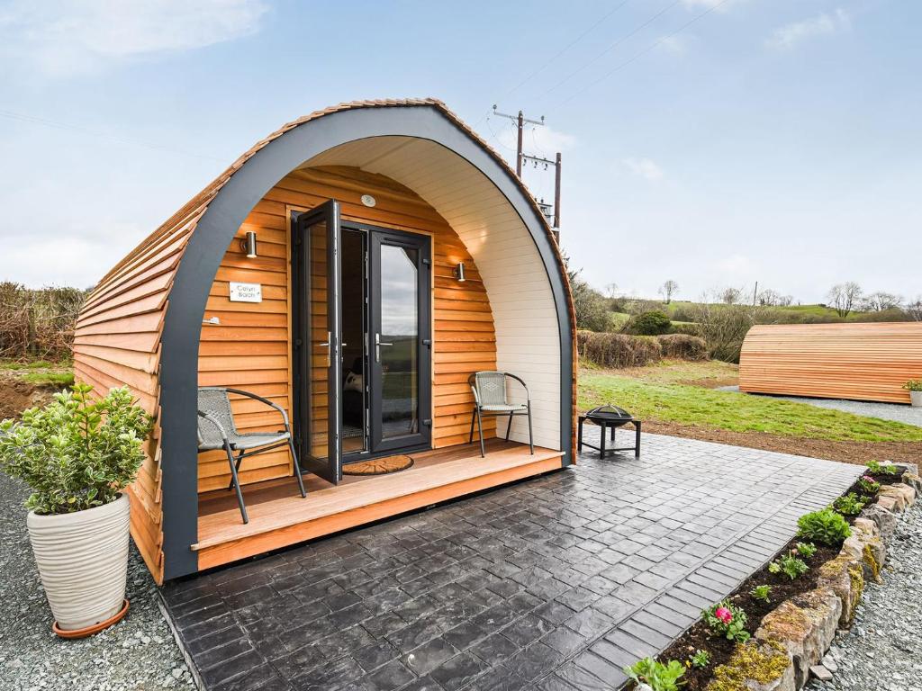 a dome tent with two chairs on a patio at Celyn Bach - Uk37083 in Llanwddyn