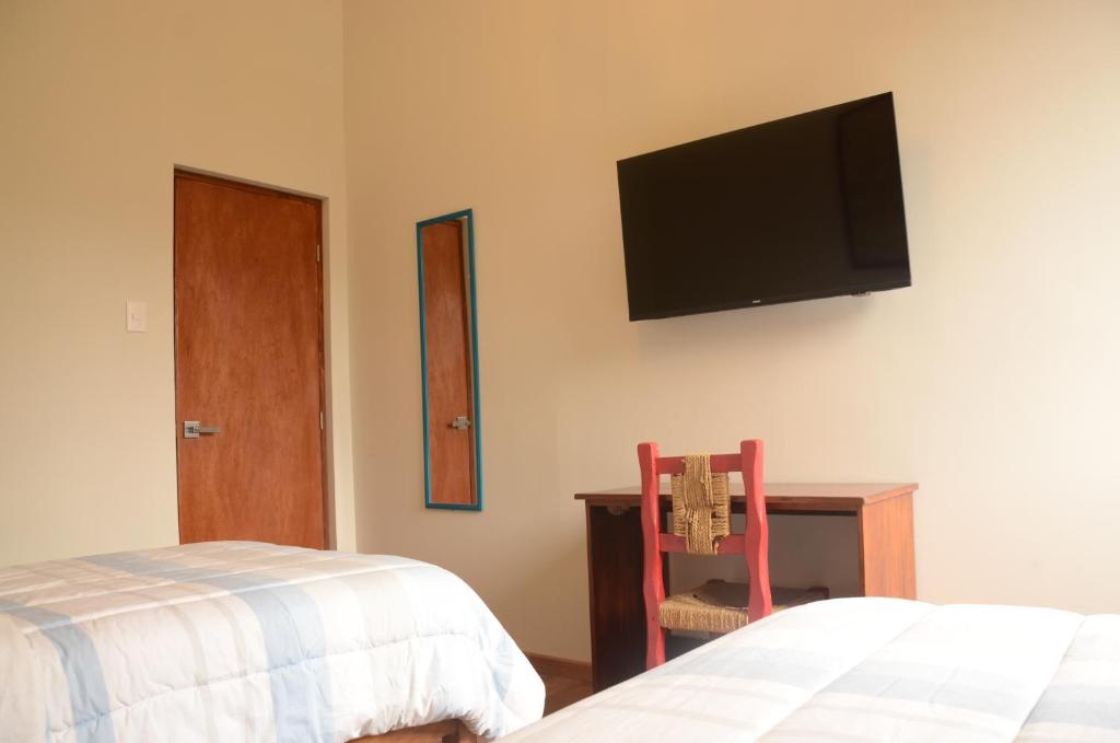 Postel nebo postele na pokoji v ubytování Flying Dog Lima B&B