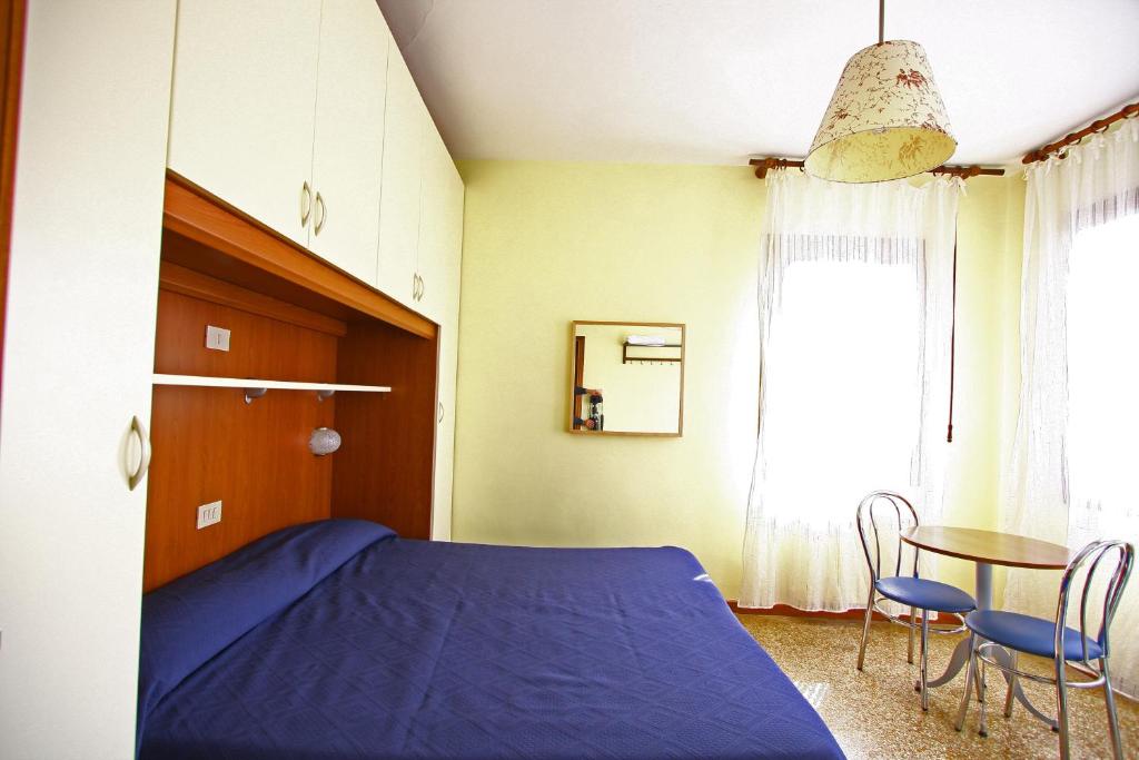 Postel nebo postele na pokoji v ubytování Hotel dalla Mora