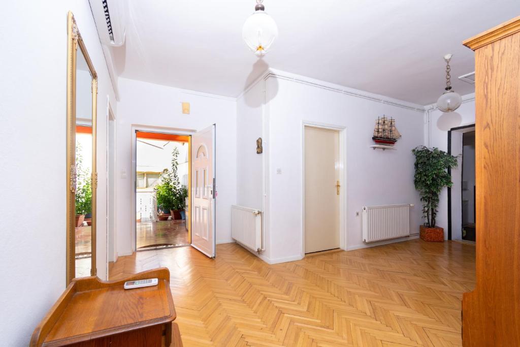 a hallway with white walls and a hard wood floor at Apartments with a parking space Bibinje, Zadar - 18275 in Bibinje