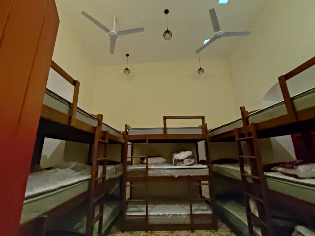 Postel nebo postele na pokoji v ubytování MELISA HOSTAL
