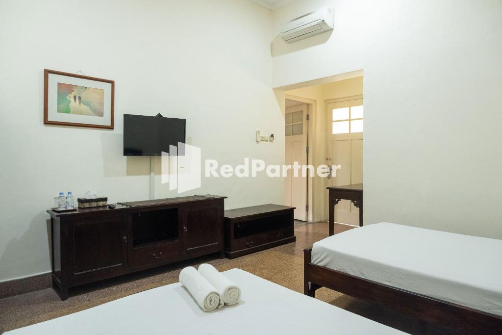 Urbanview Monginsidi Heritage Yogyakarta - Chambre Lits Jumeaux Standard