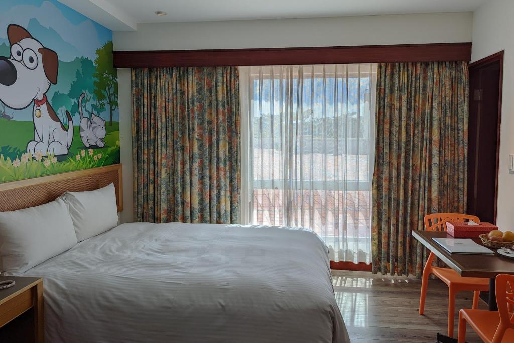 A bed or beds in a room at Howard Kenting Wonder House