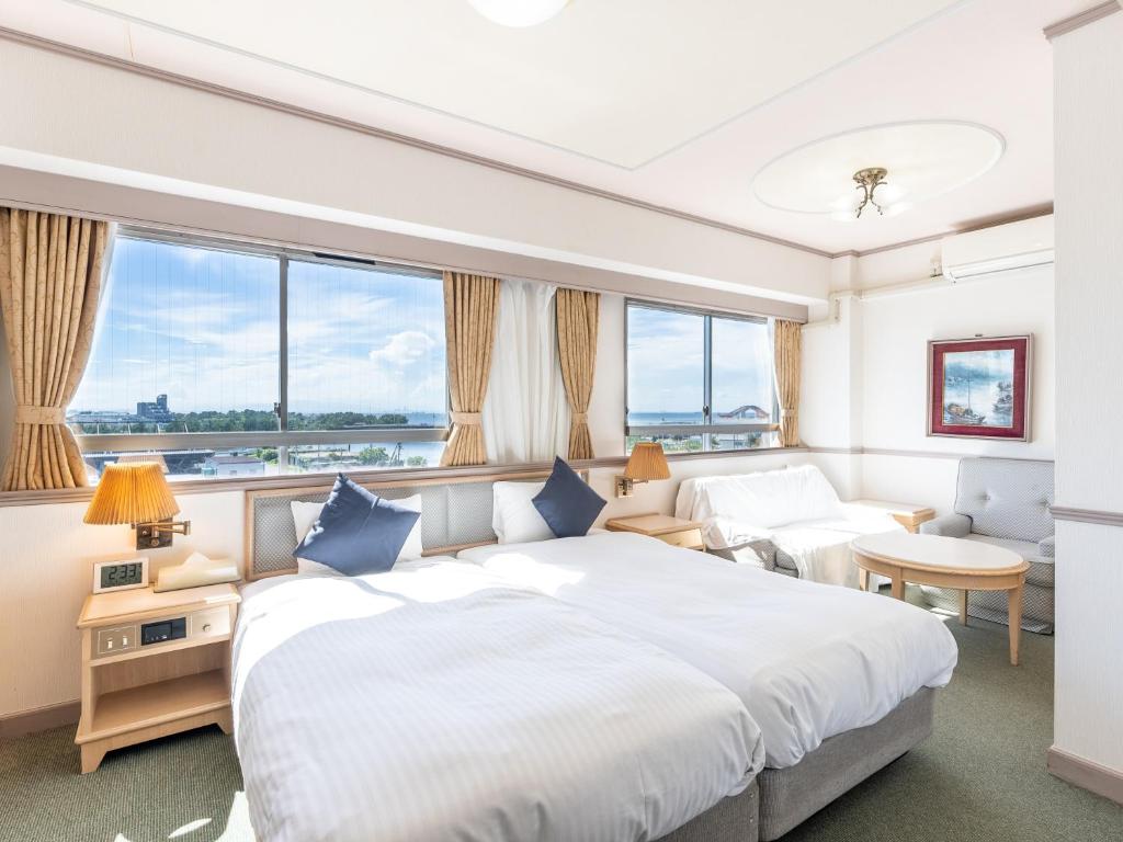 Postel nebo postele na pokoji v ubytování Tabist Hotel Ginga Kisarazu