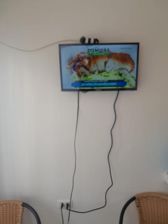 TV a/nebo společenská místnost v ubytování Cabanas bahia inglesa