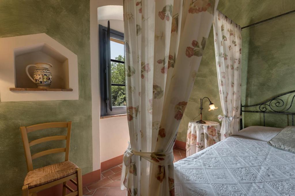 Postel nebo postele na pokoji v ubytování Il Borghetto Tuscan Holidays