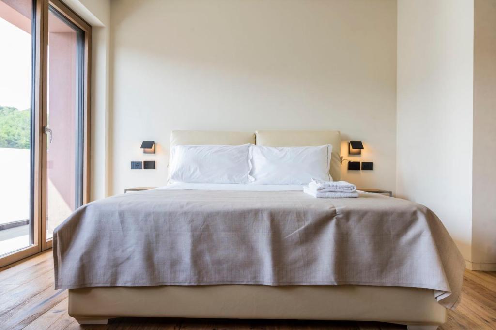 Postel nebo postele na pokoji v ubytování Bihotel
