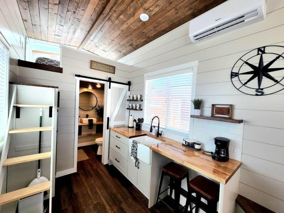 a kitchen with a counter in a tiny house at Family-Friendly Tiny Home Firepit BBQ Zion in Apple Valley