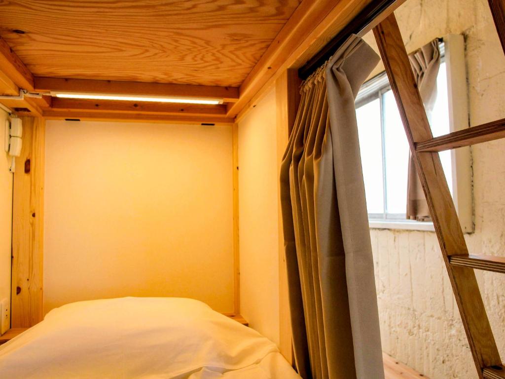 Postel nebo postele na pokoji v ubytování 14 Guesthouse Mt.Fuji