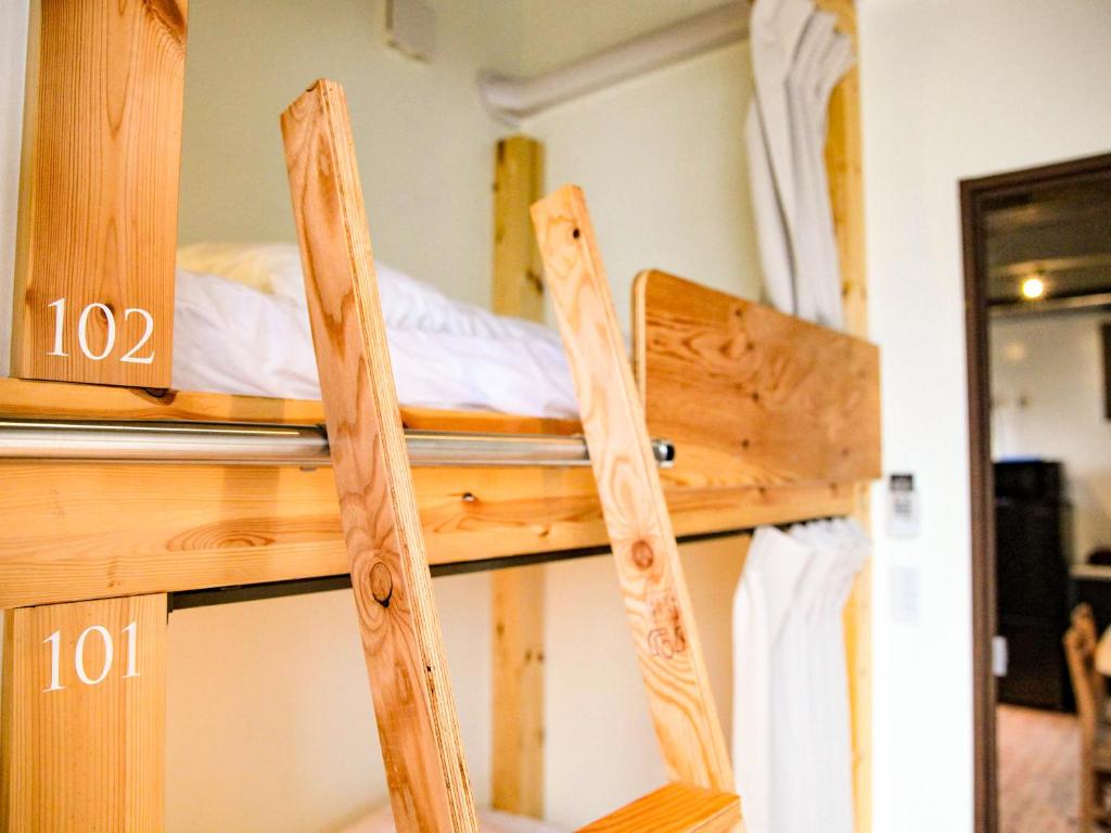 Postel nebo postele na pokoji v ubytování 14 Guesthouse Mt.Fuji