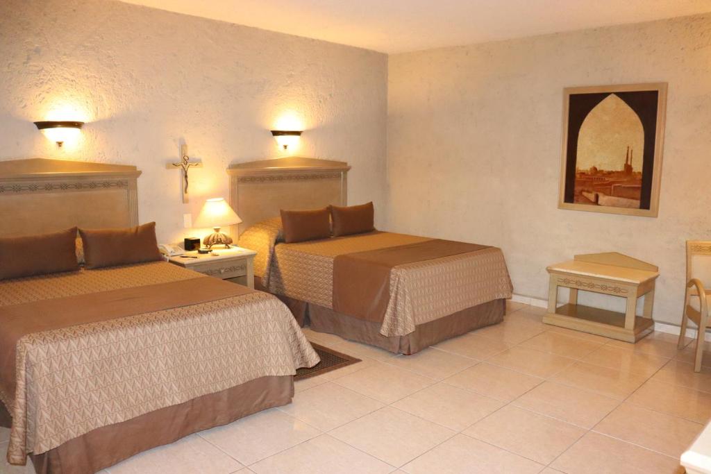 Postel nebo postele na pokoji v ubytování Suites Layfer, Córdoba, Veracruz, México