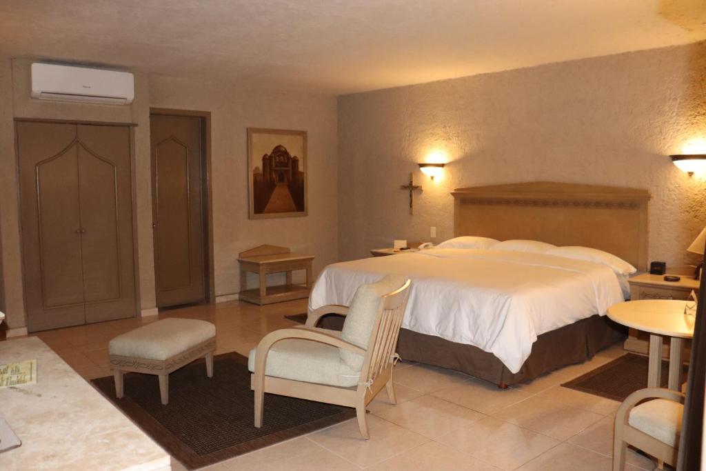 Postel nebo postele na pokoji v ubytování Suites Layfer, Córdoba, Veracruz, México