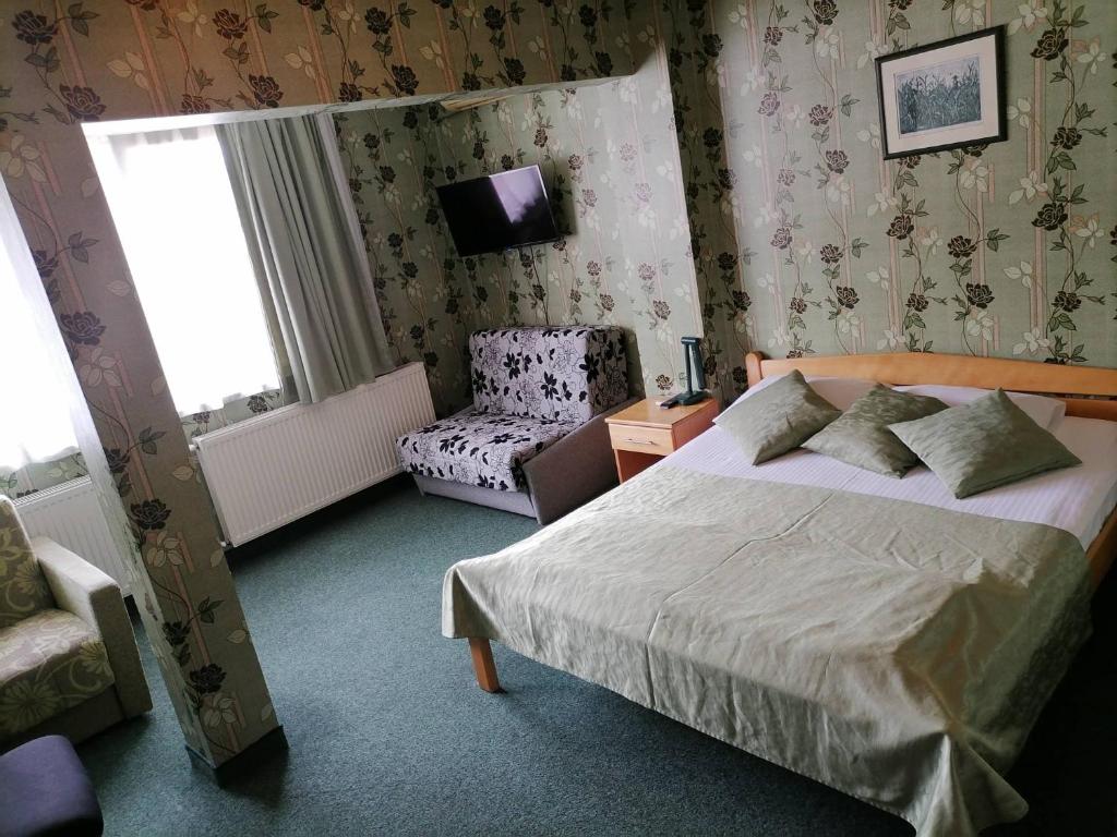 Postel nebo postele na pokoji v ubytování Hotel Slodes