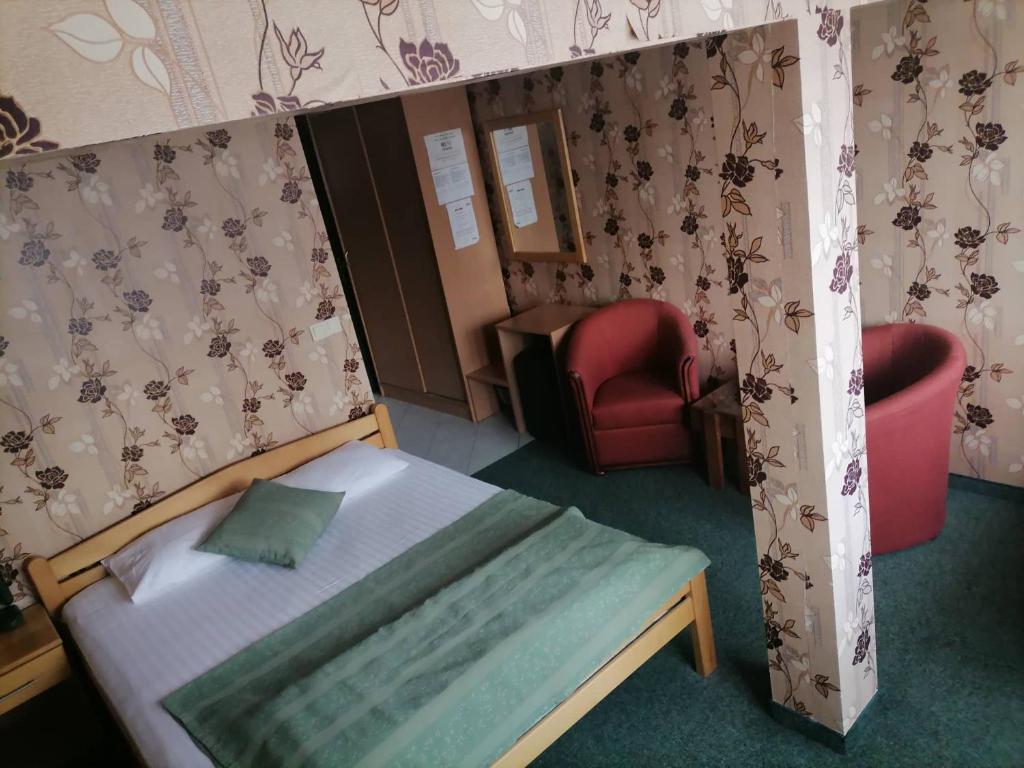 Postel nebo postele na pokoji v ubytování Hotel Slodes