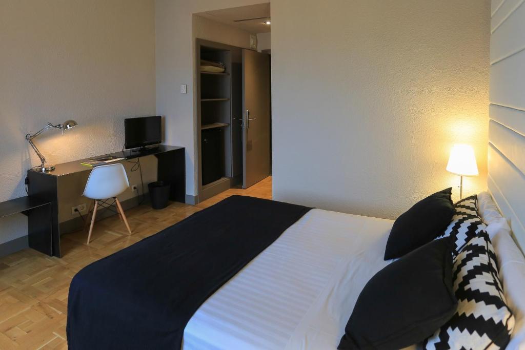 Postel nebo postele na pokoji v ubytování Habitus Hotel Leyre